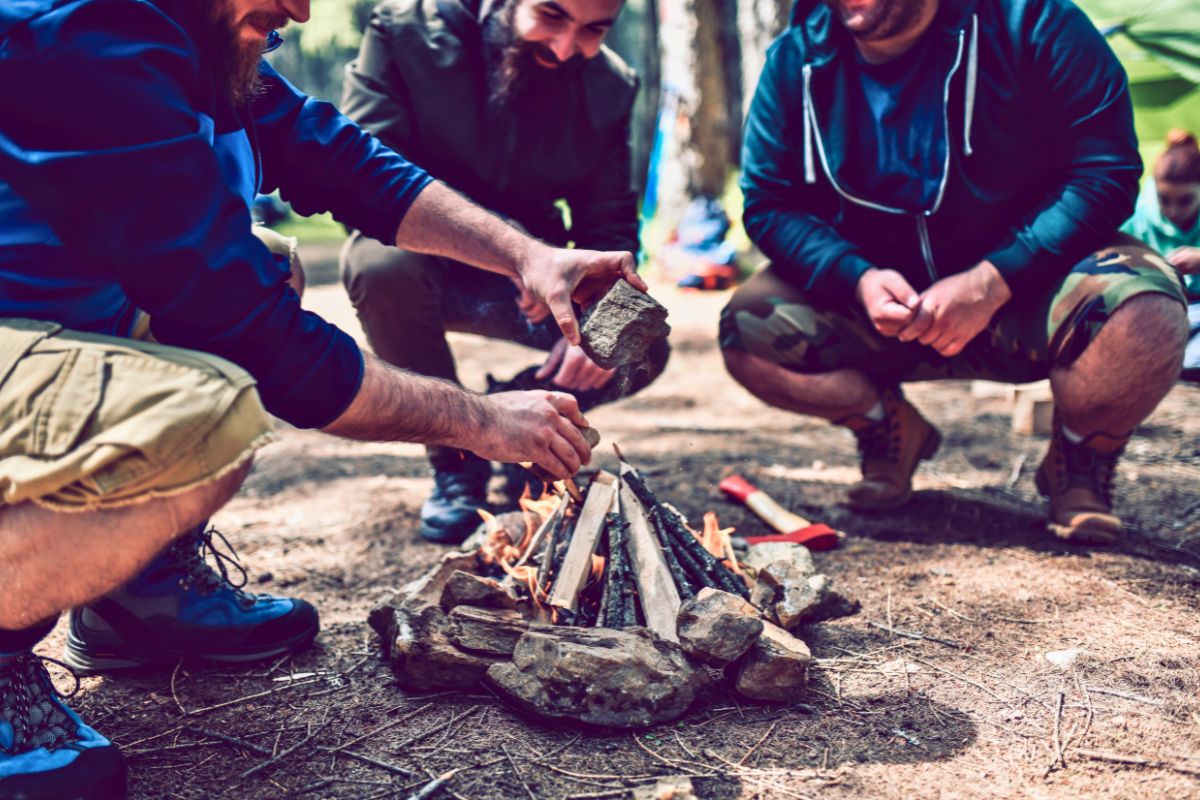 people starting fire without firelighters - an important part of survival skills