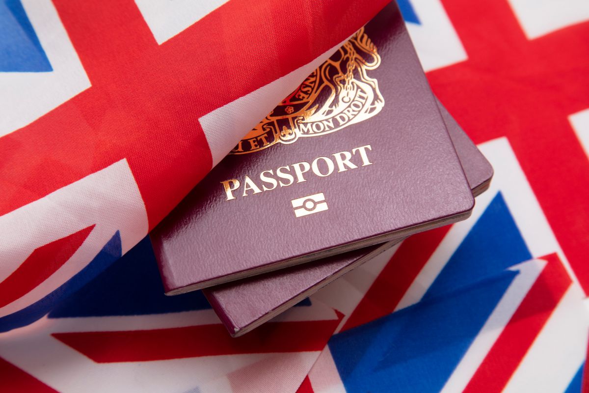 uk flag covering passports representing recent uk immigration law changes
